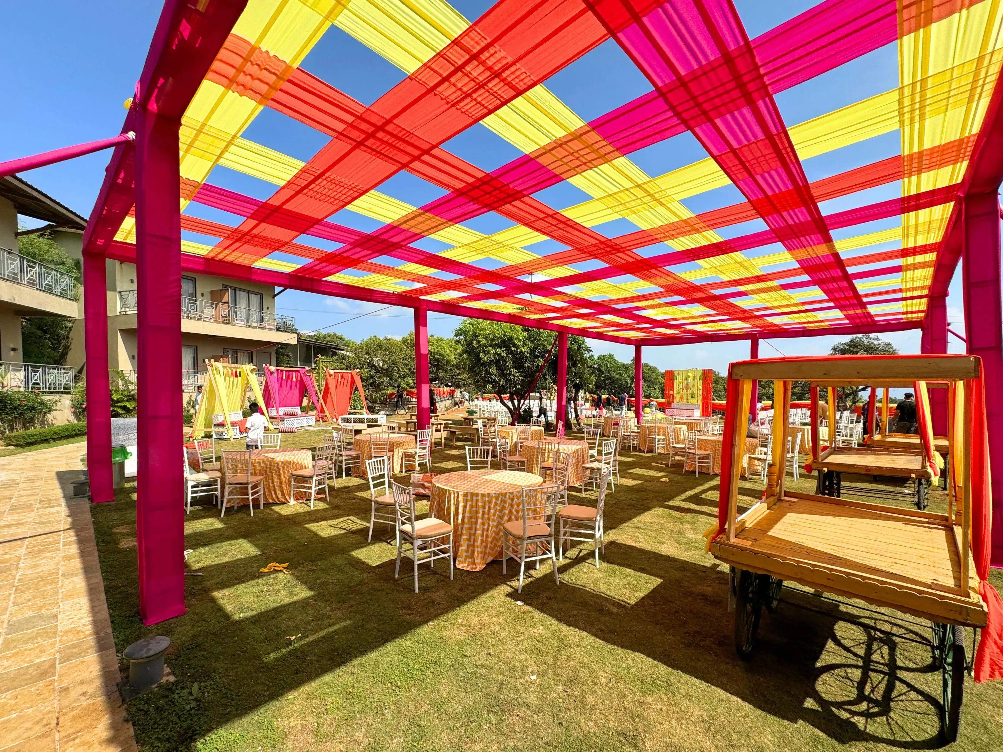 Outdoor wedding seating setup on the lawn at Ramsukh Resort, Mahabaleshwar, with vibrant canopy and seating arrangements.